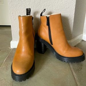 Dr. Martens heeled ankle boots.